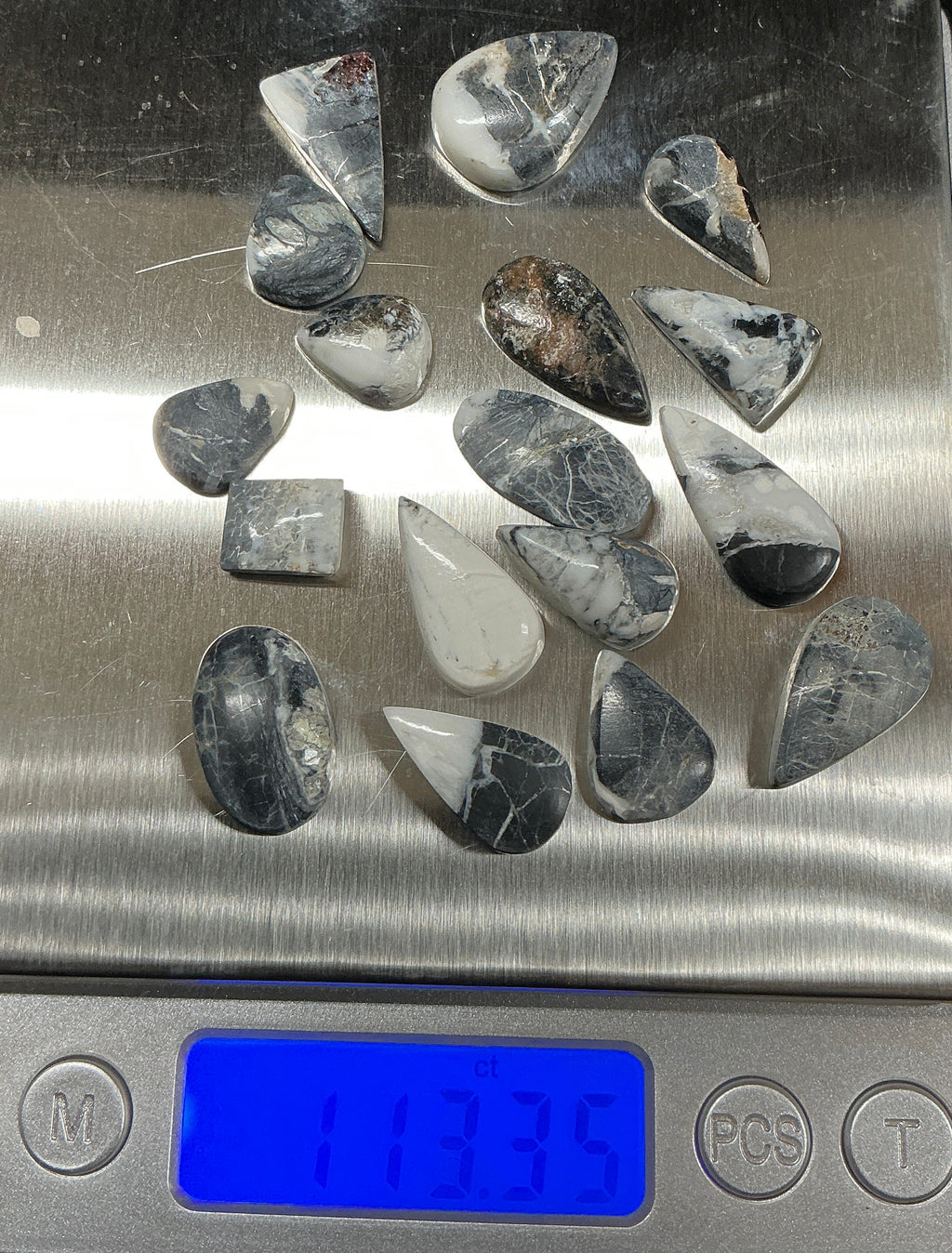 White Buffalo Cabochons Lot. ~113 Carats. $141.25. Lot 7